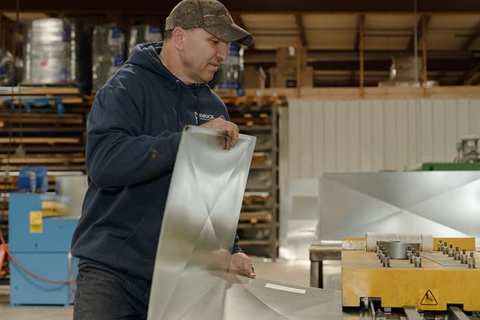 Factory Worker With Sheet Metal