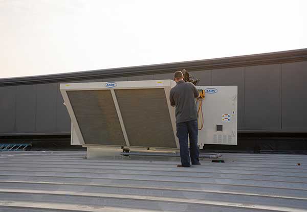 service technician performing preventative maintenance visit